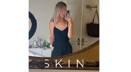 Professional woman takes a selfie at Skin by Steph, Market Drayton, England, GB, showing a stylish beauty room.