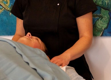 Therapist providing soothing massage at Healing Touch Therapies (Millbrook) in Southampton, England, GB.