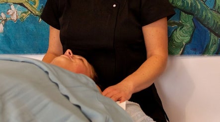 Therapist providing soothing massage at Healing Touch Therapies (Millbrook) in Southampton, England, GB.