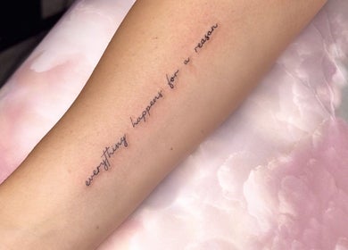 Delicate script tattoo on arm at Finelines by Fern Tattoo in Wickford, England, GB.