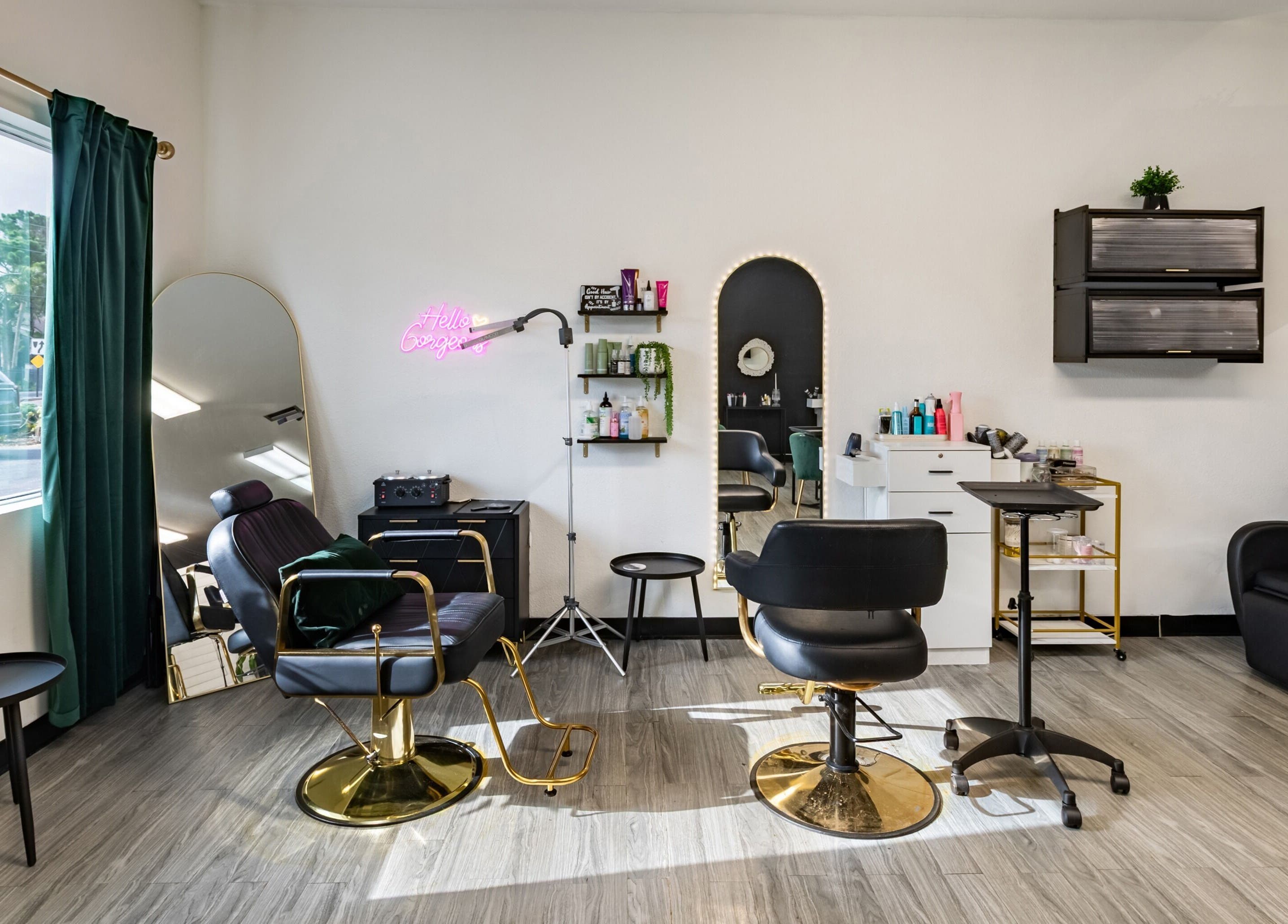 Modern interior of YK Beauty Salon in Bradenton, Florida, US, featuring stylish chairs and mirrors.