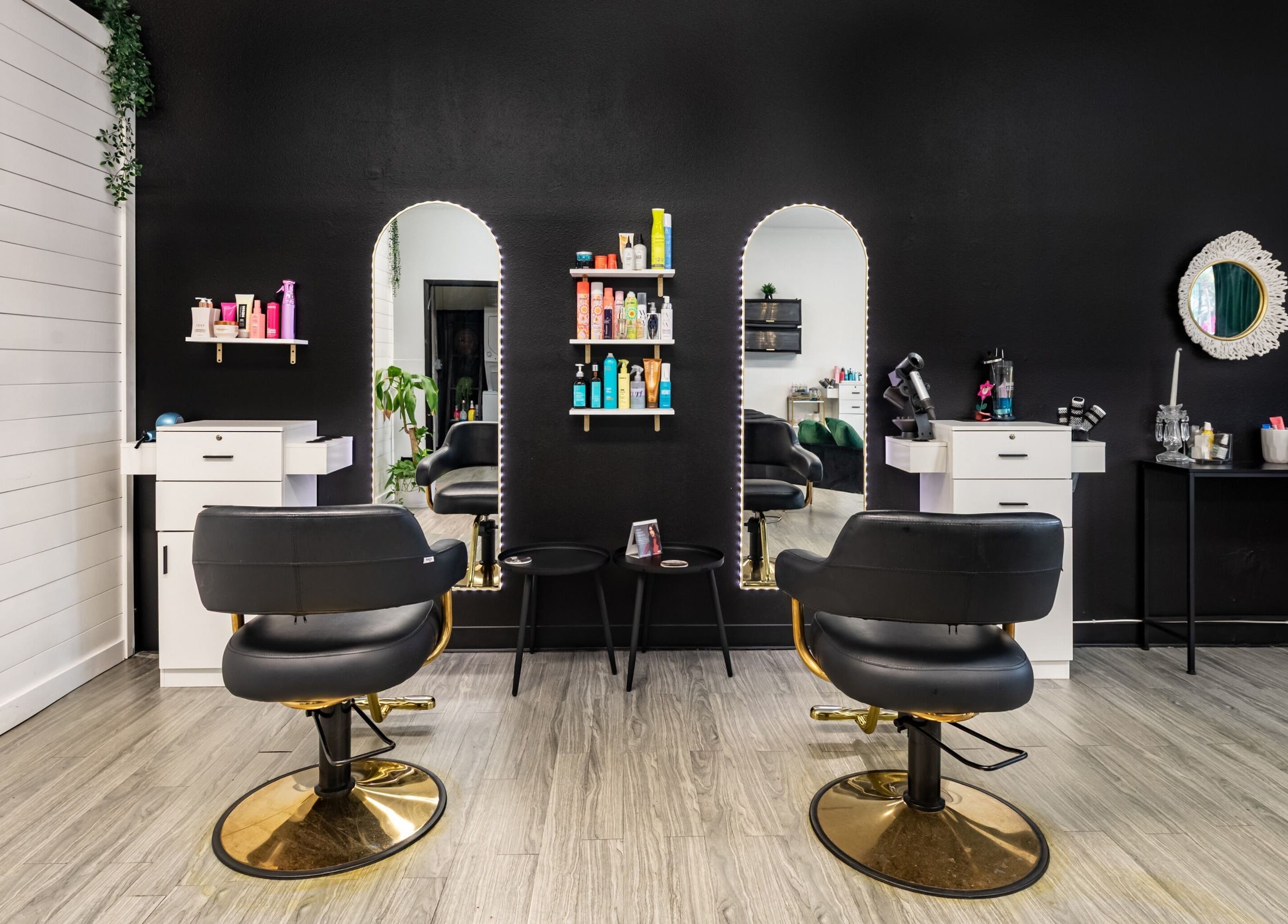 Interior of YK Beauty Salon showcasing stylish salon chairs and mirrors in Bradenton, Florida, US.