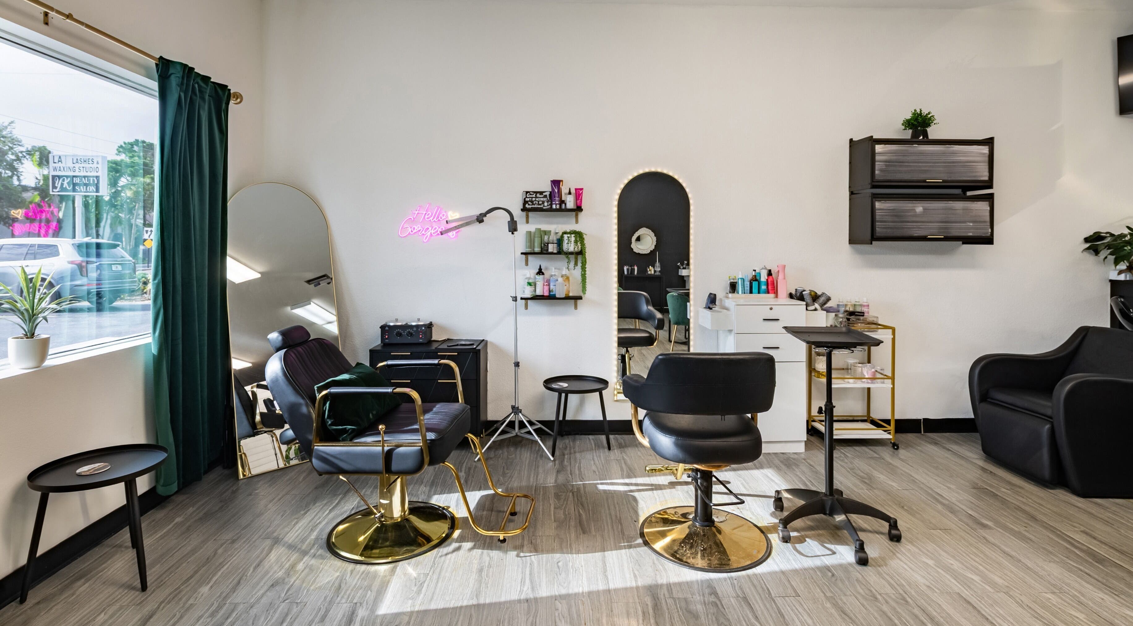 Modern interior of YK Beauty Salon in Bradenton, Florida, US, showcasing stylish chairs and beauty products.