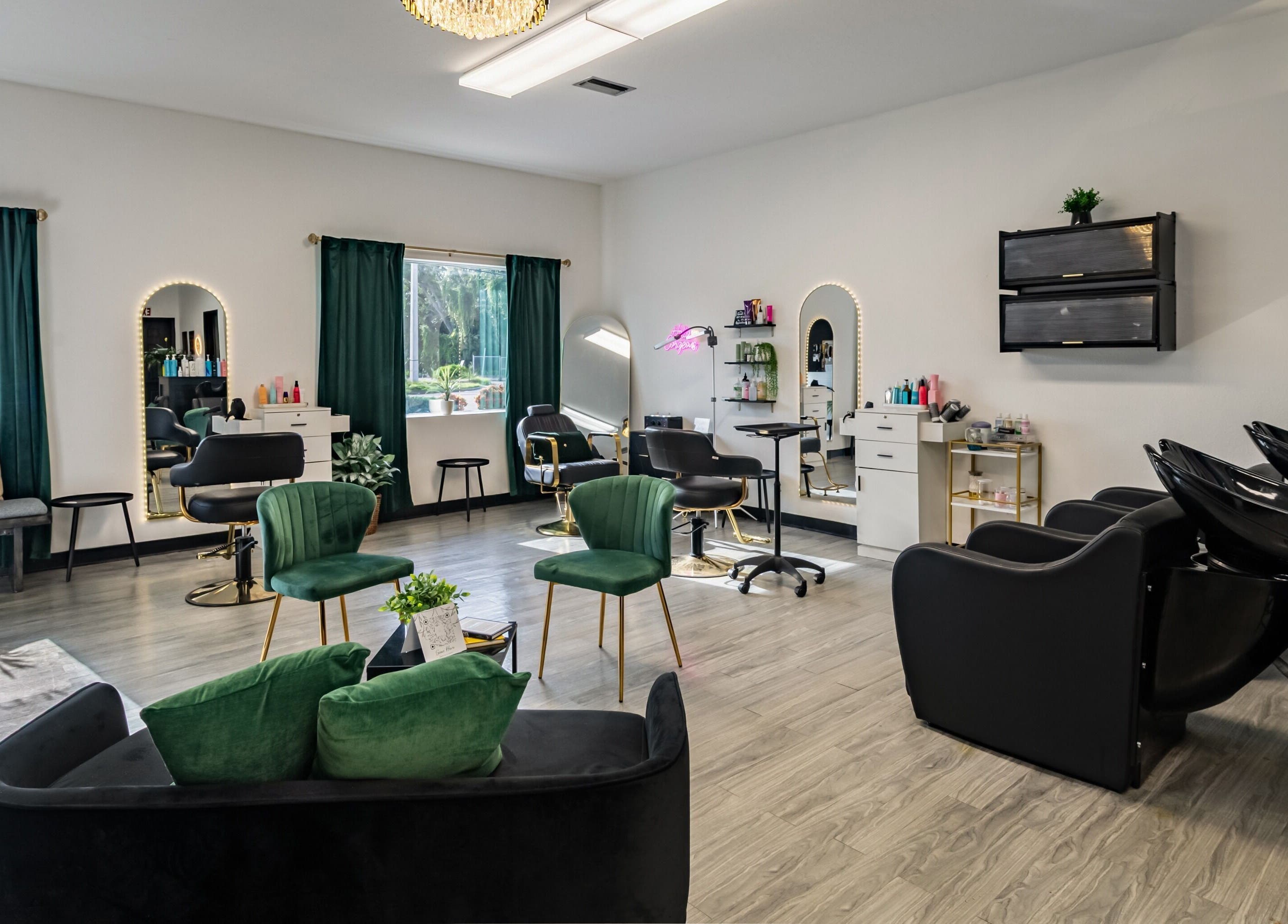 Elegant interior of YK Beauty Salon in Bradenton, Florida, US with chic seating and modern styling stations.