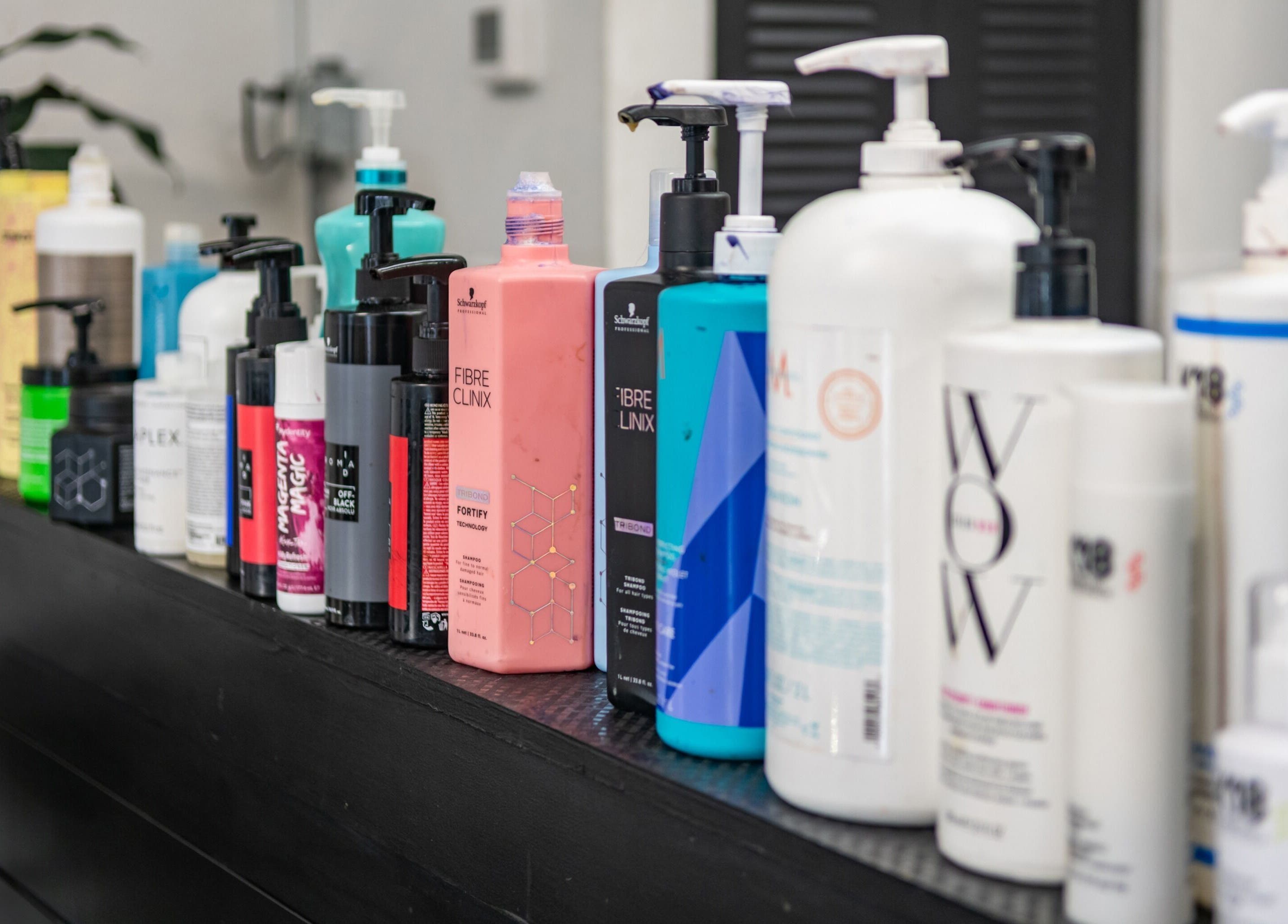 Assorted hair products at YK Beauty Salon in Bradenton, Florida, US, showcasing premium salon care.