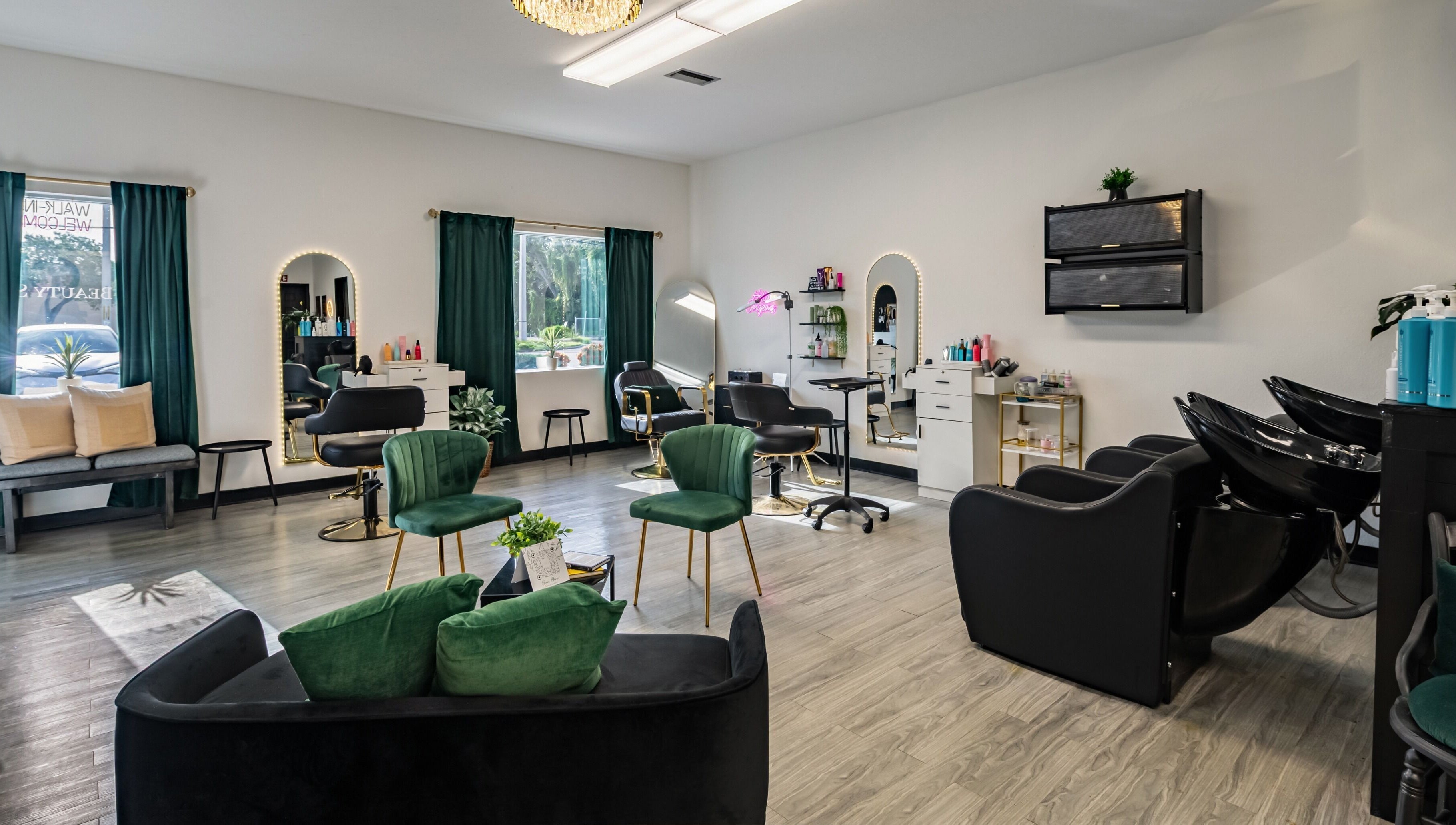 Chic interior of YK Beauty Salon in Bradenton, Florida, US showcasing modern chairs and mirrors.