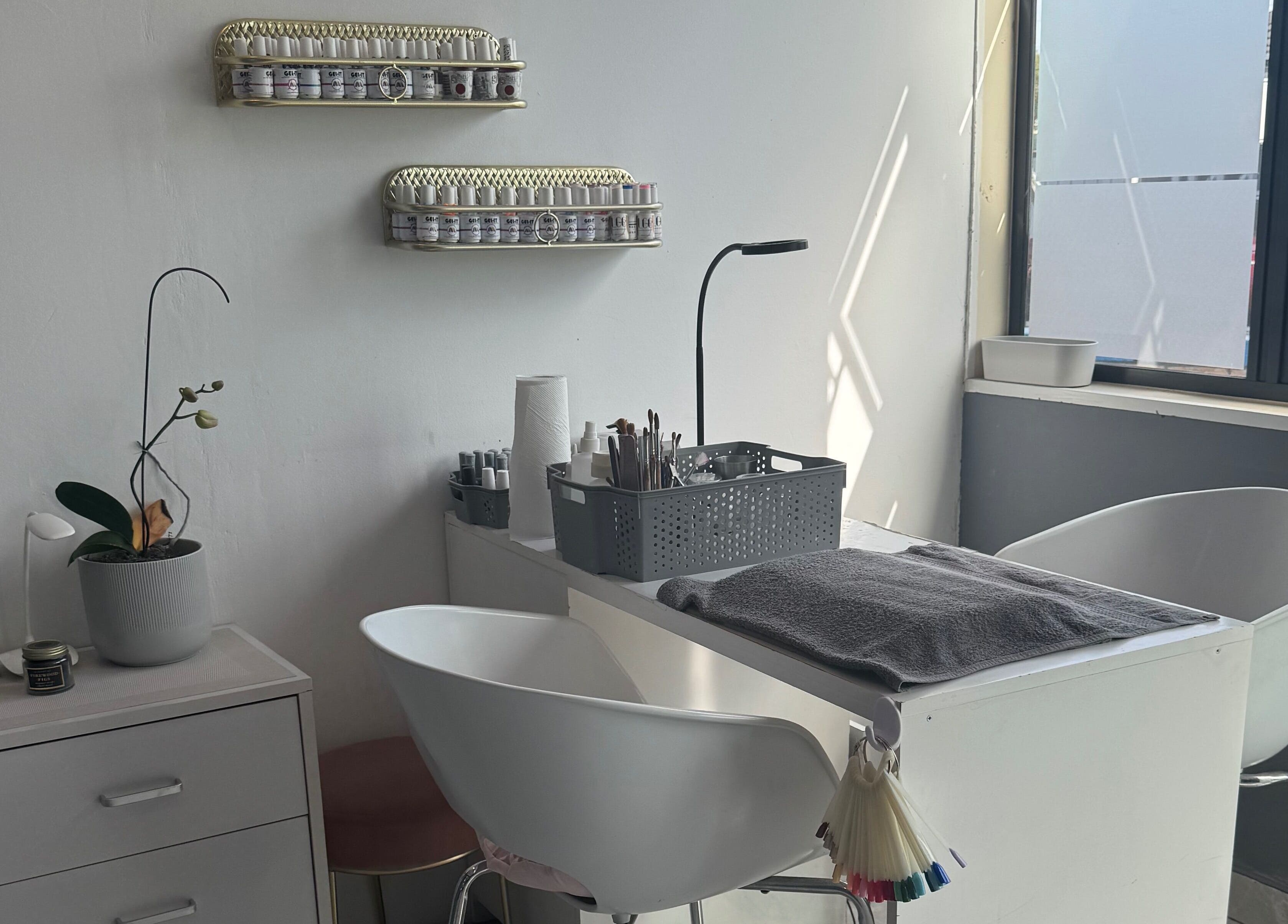 Modern nail station at Glam Nails&Beauty in Cape Town, Western Cape, ZA, featuring sleek design and essential tools.