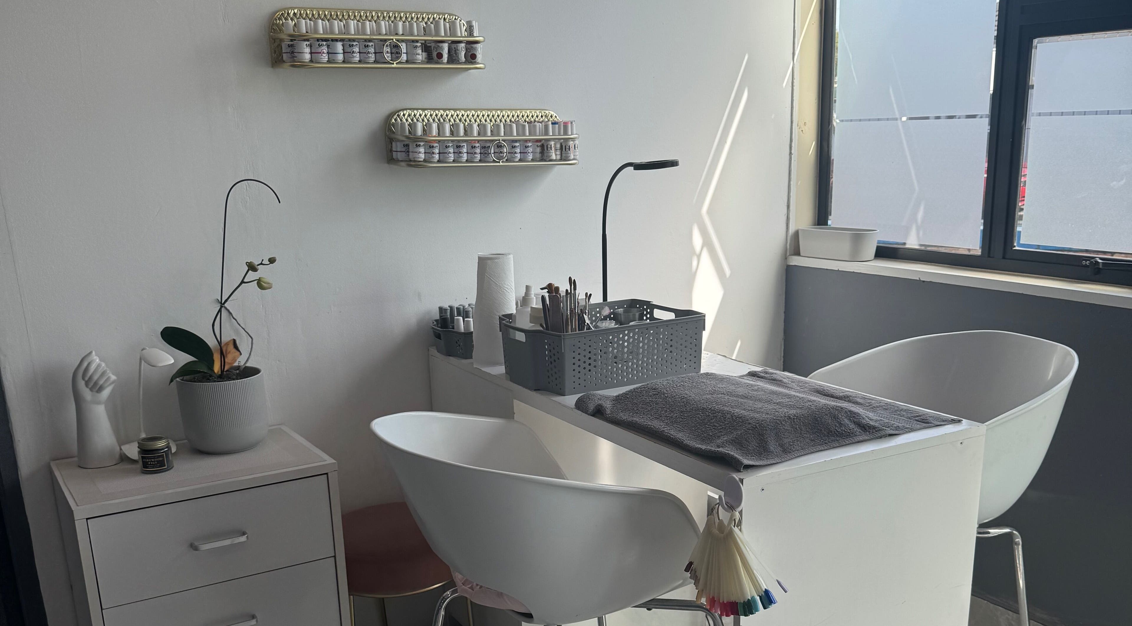 Modern nail station at Glam Nails&Beauty in Cape Town, Western Cape, ZA, featuring sleek design and essential tools.