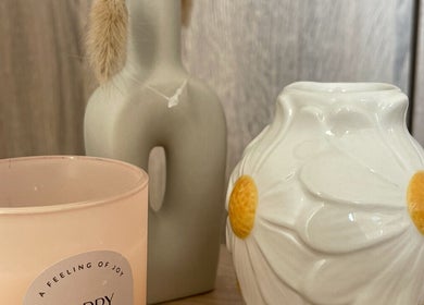 Calming decor at BeautyByErica, Youghal, County Cork, IE, featuring a candle and vases on display.