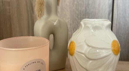 Calming decor at BeautyByErica, Youghal, County Cork, IE, featuring a candle and vases on display.