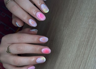 Colorful nail art design at BeautyByErica, Youghal, County Cork, IE, showcasing intricate details and vibrant hues.