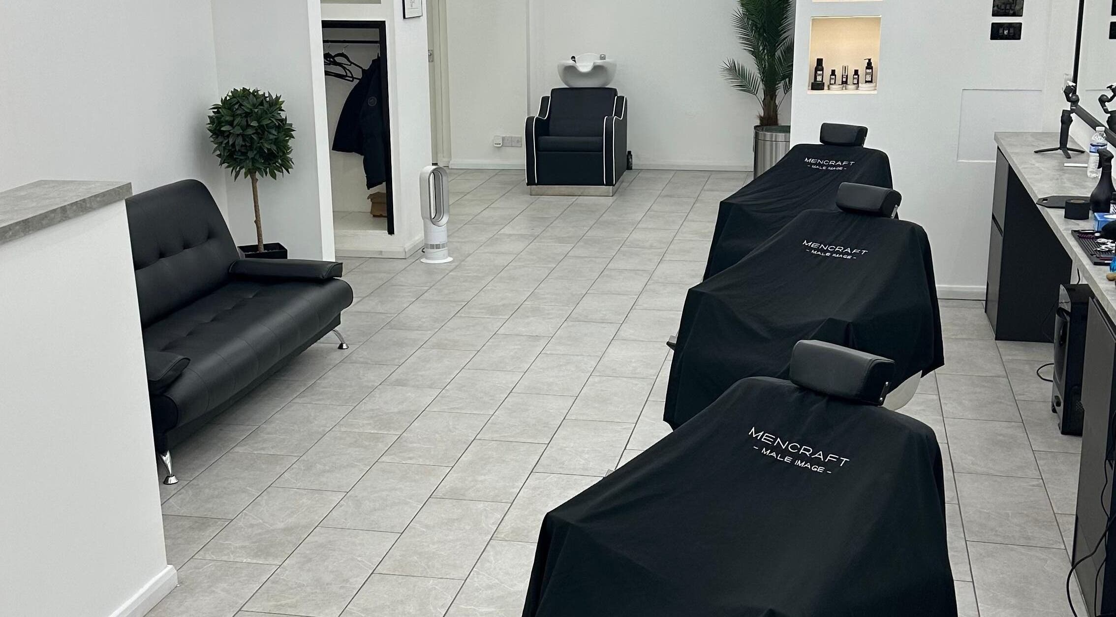 Modern interior of Mencraft, a beauty venue in Brighton And Hove, England, GB, featuring sleek chairs and decor.