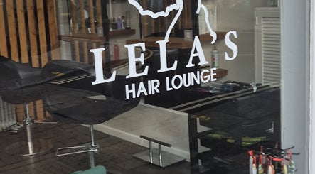 Entrance of Lela's Hair Lounge in Weston-super-Mare, England, showcasing modern interior design.