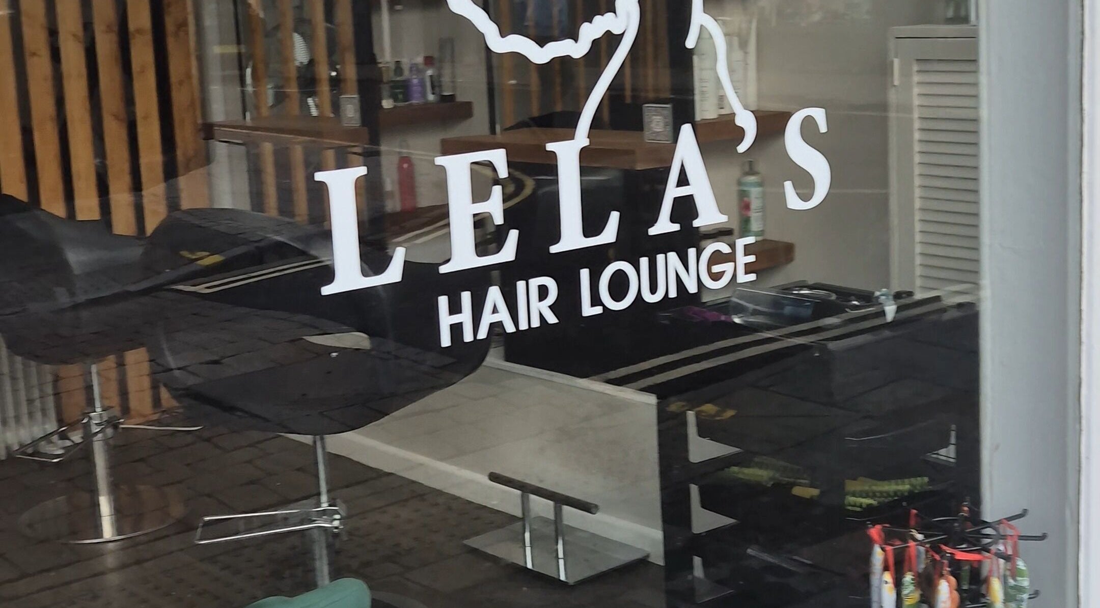 Entrance of Lela's Hair Lounge in Weston-super-Mare, England, showcasing modern interior design.