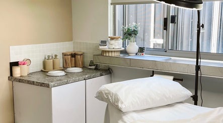 Treatment room at CSM Studios, Padbury, Western Australia, AU featuring a comfortable bed and clean decor.