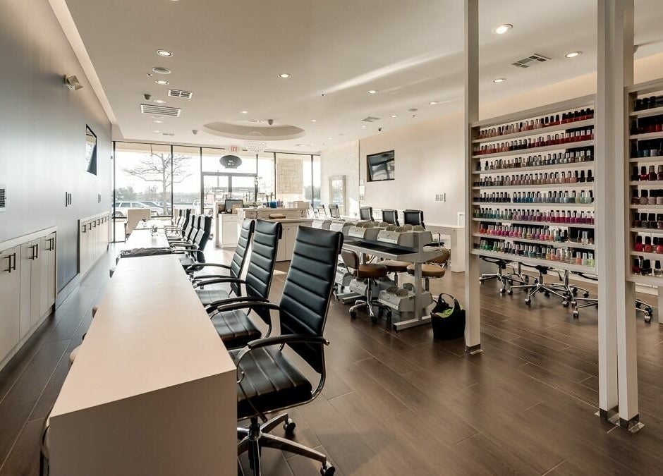 Modern nail salon interior at Nail Lounge, Allen, Texas, US, showcasing sleek design and vast polish selection.
