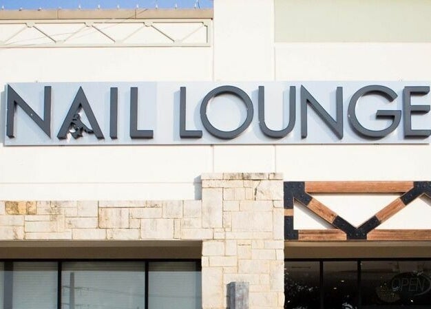 Exterior sign of Nail Lounge at Allen, Texas, US, showcasing modern design and welcoming entrance.