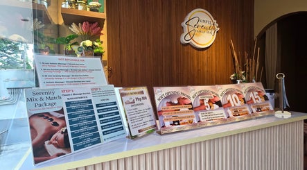 Simply Serenity Family Spa Dasmariñas showcases spa packages and soft opening promos at their reception.