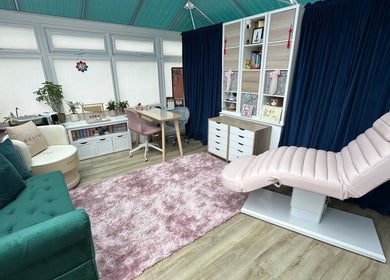 Calming beauty room at Inner Divine Beauty - Home Studio, Manchester, England, GB with plush seating and decor.