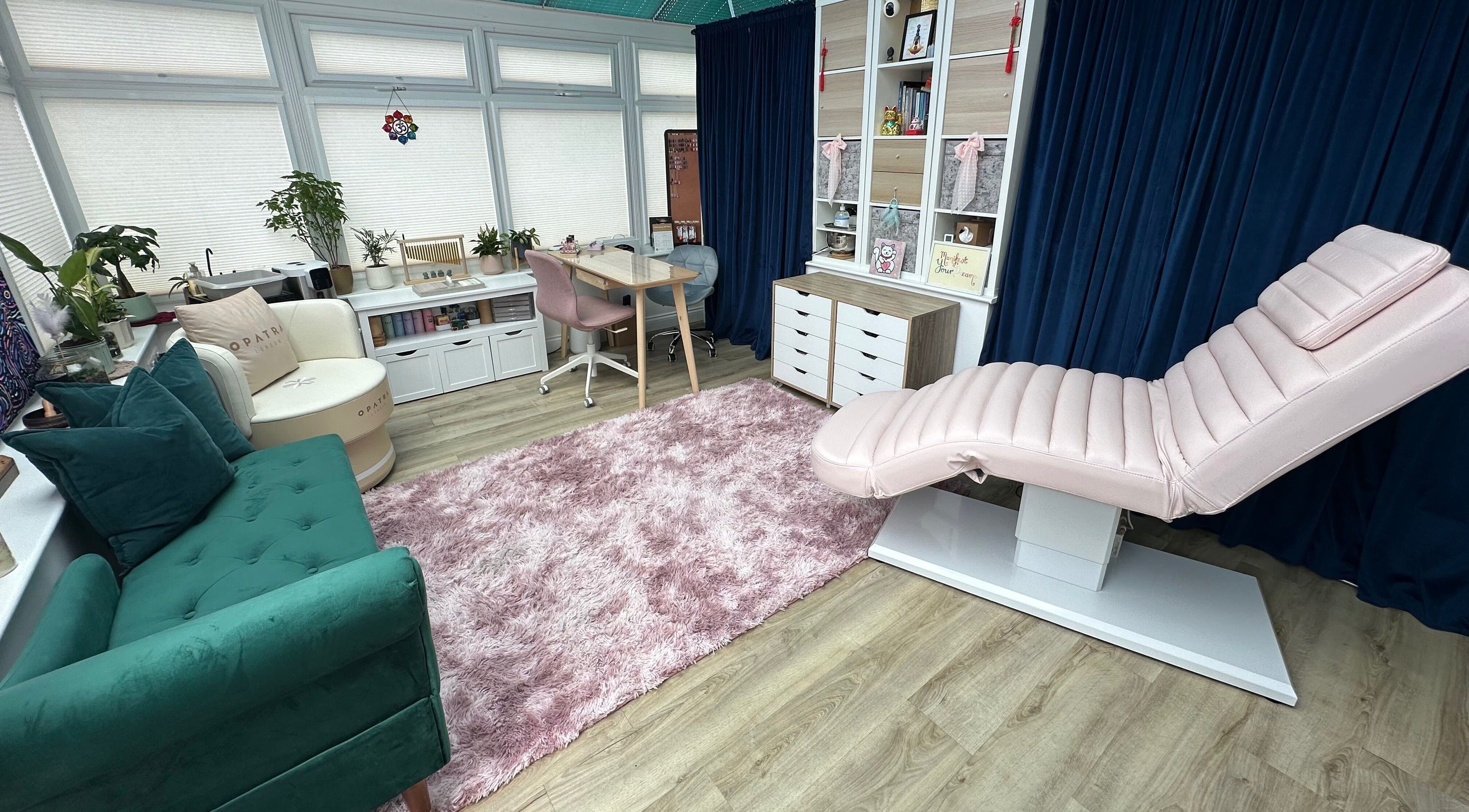 Relaxing interior of Inner Divine Beauty - Home Studio, Manchester, England, GB featuring plush seating and spa bed.
