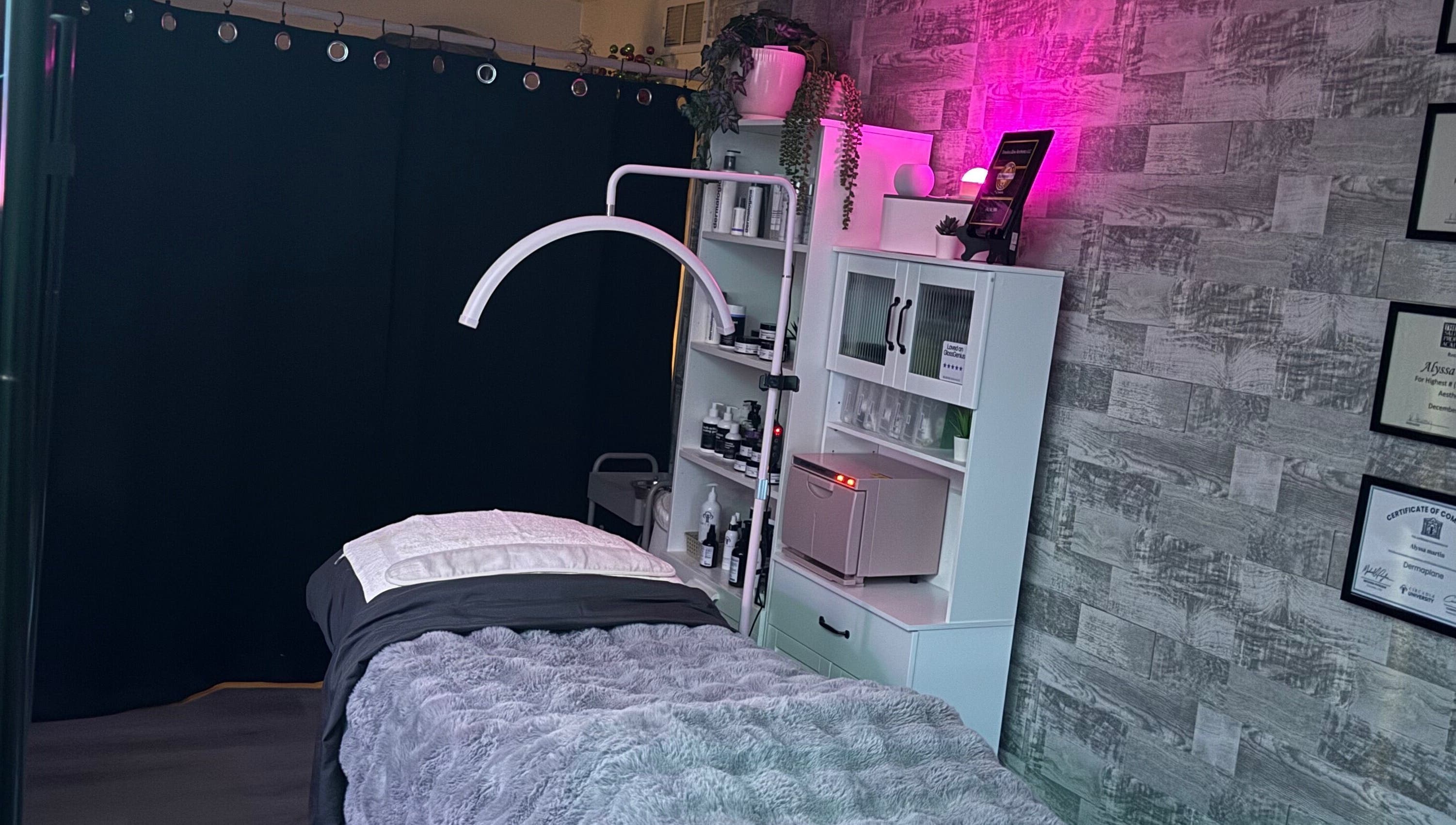Relaxing treatment room at Timeless Glow Aesthetics, Kenosha, Wisconsin, US with ambient lighting and cozy decor.