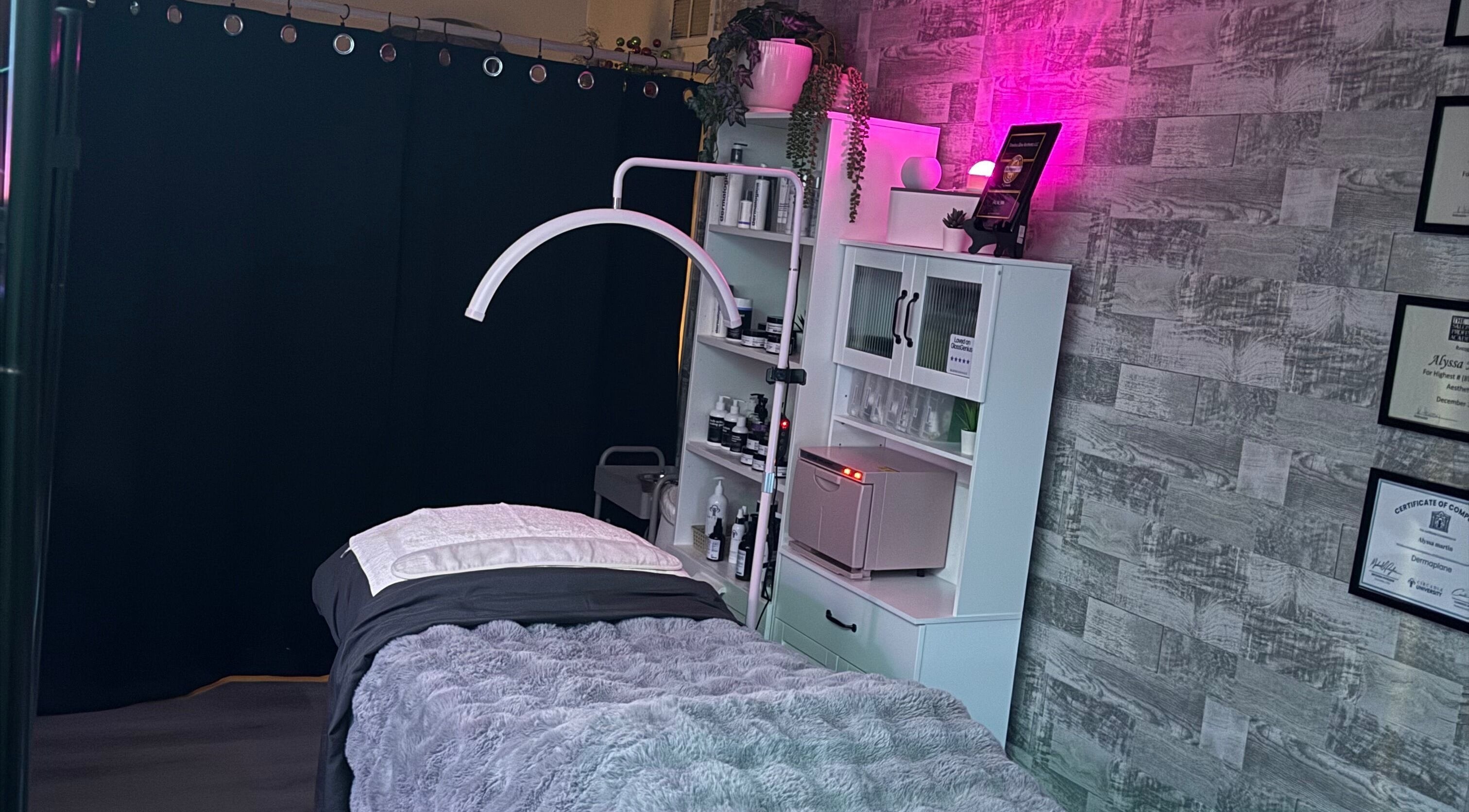 Relaxing treatment room at Timeless Glow Aesthetics, Kenosha, Wisconsin, US with ambient lighting and cozy decor.