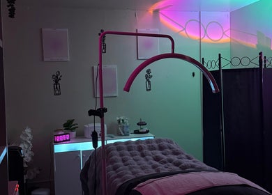 Relaxing treatment room at Timeless Glow Aesthetics, Kenosha, Wisconsin, US with ambient lighting and cozy decor.