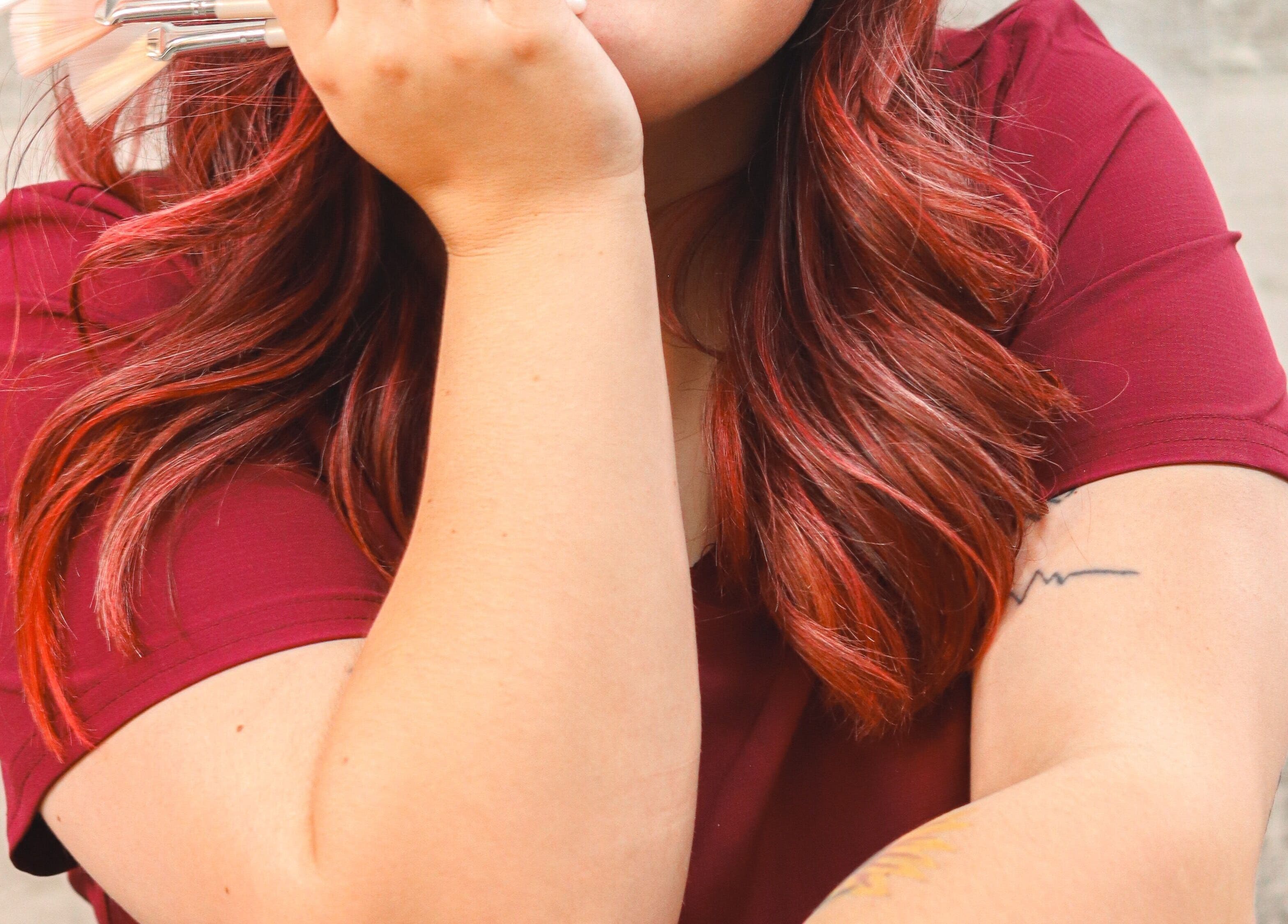 Makeup artist with brushes at Timeless Glow Aesthetics in Kenosha, Wisconsin, US, enhancing natural beauty.