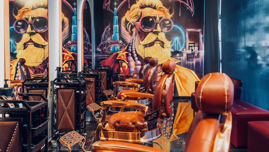 Stylish barber chairs and artistic mural at Let's Fade in Dubai, Dubai, AE. Modern grooming experience.
