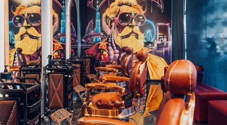 Stylish barber chairs and artistic mural at Let's Fade in Dubai, Dubai, AE. Modern grooming experience.