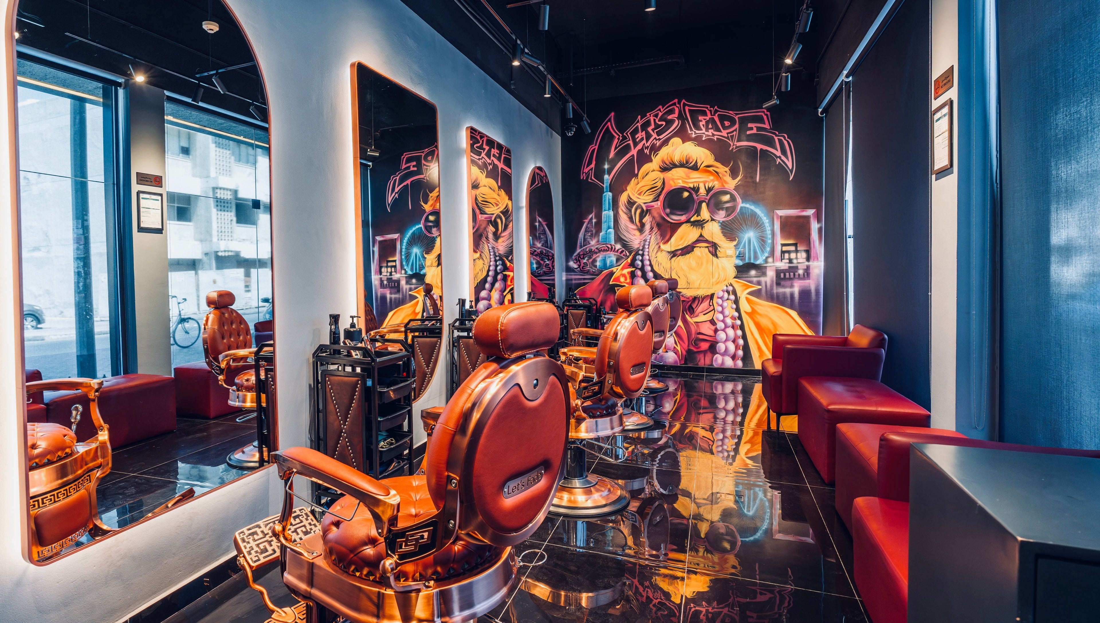 Modern barber shop at Let's Fade Bespoke in Dubai, Dubai, AE, featuring stylish chairs and vibrant art.