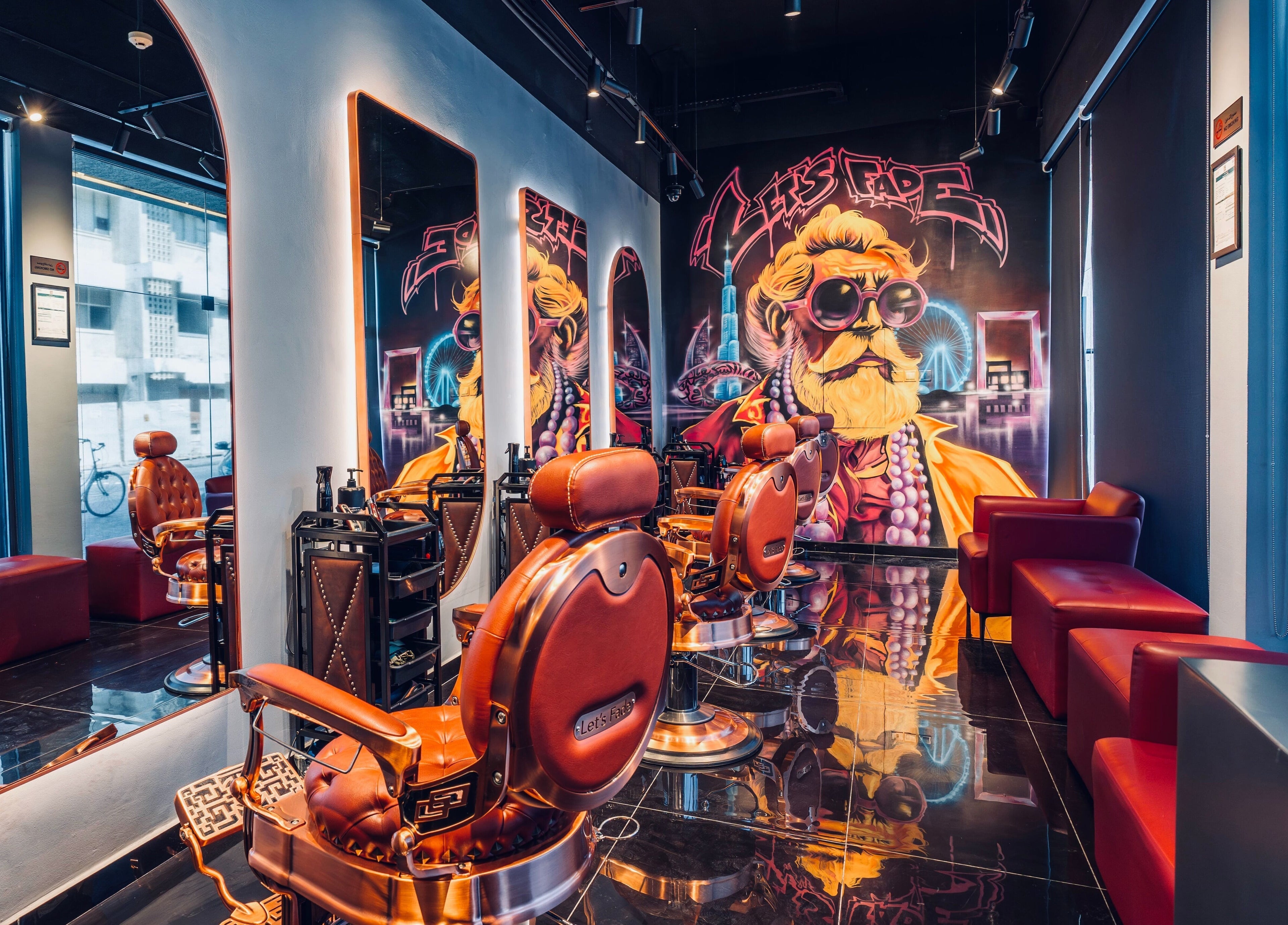Modern barber shop at Let's Fade Bespoke in Dubai, Dubai, AE, featuring stylish chairs and vibrant art.