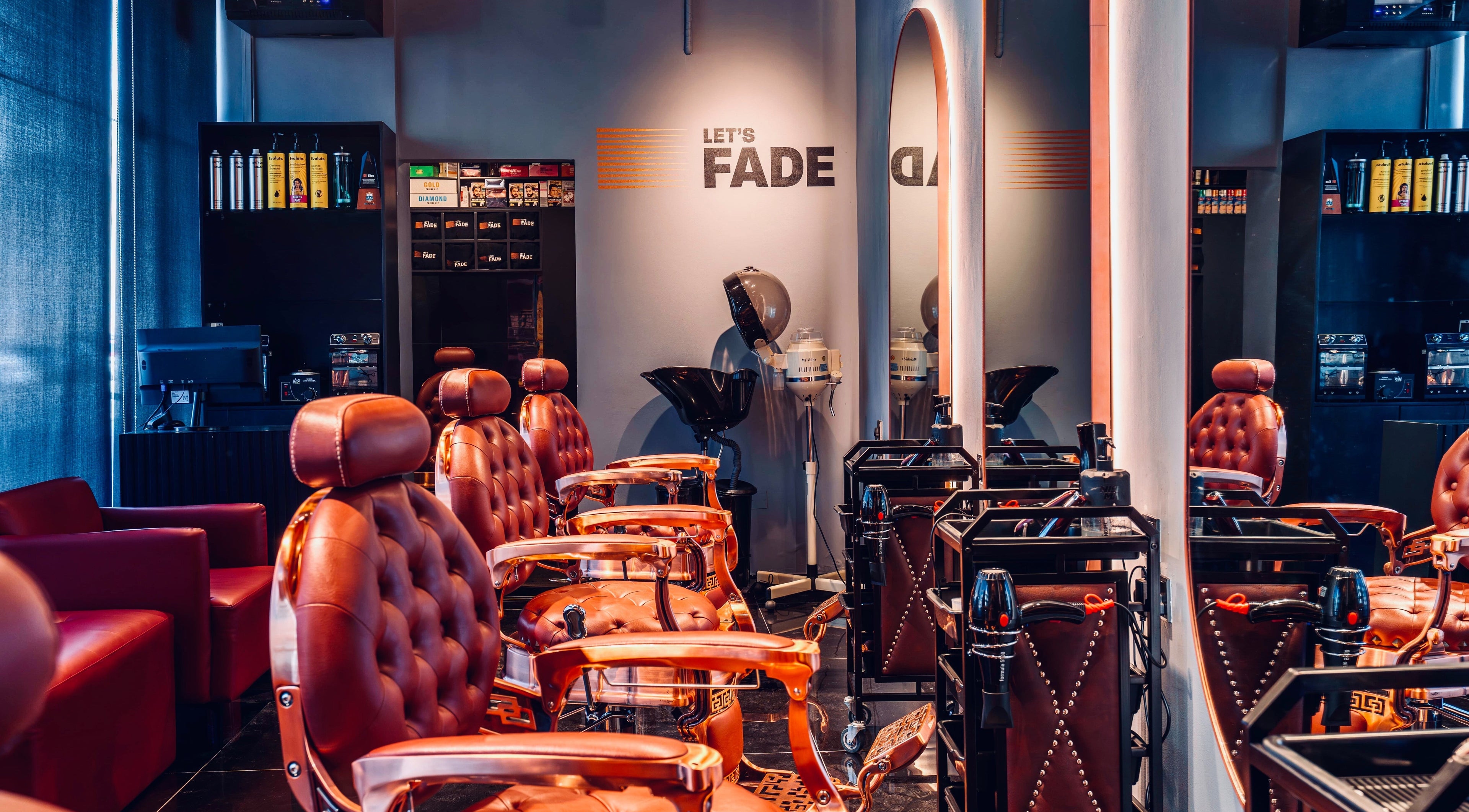 Interior of Let's Fade Bespoke salon in Dubai, Dubai, AE with vintage chairs and modern decor.