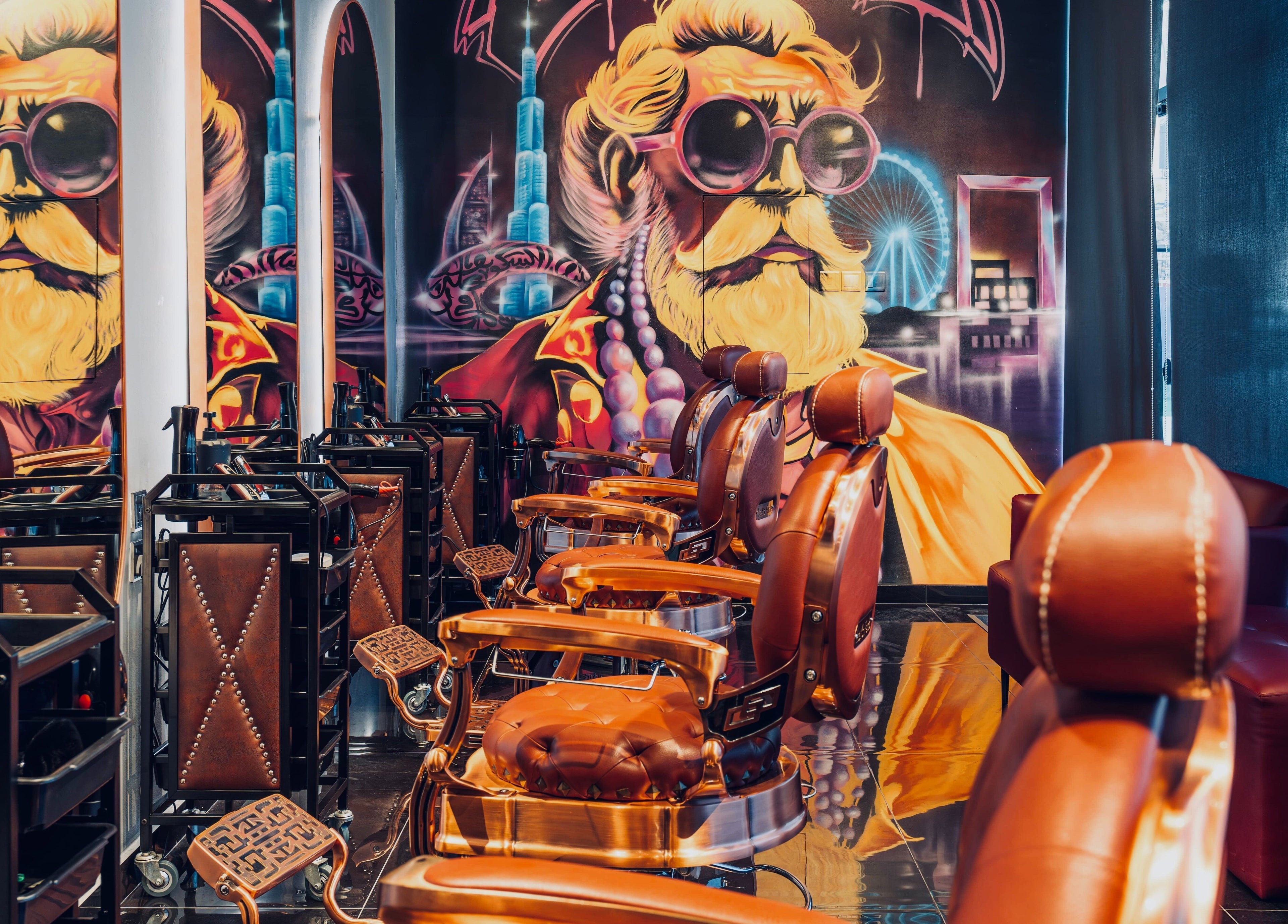 Stylish barber chairs at Let's Fade Bespoke, Dubai, Dubai, AE, with vibrant wall art.