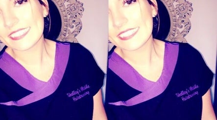 Smiling stylist at Hair By Shelley, Braintree, England, GB in branded uniform.