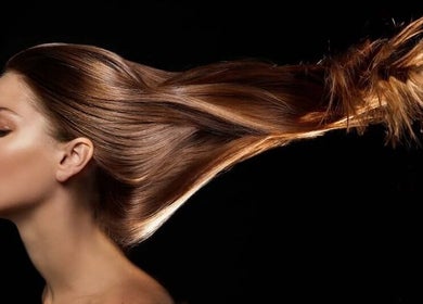 Brunette hair flowing in motion at Hair By Shelley, Braintree, England, GB.