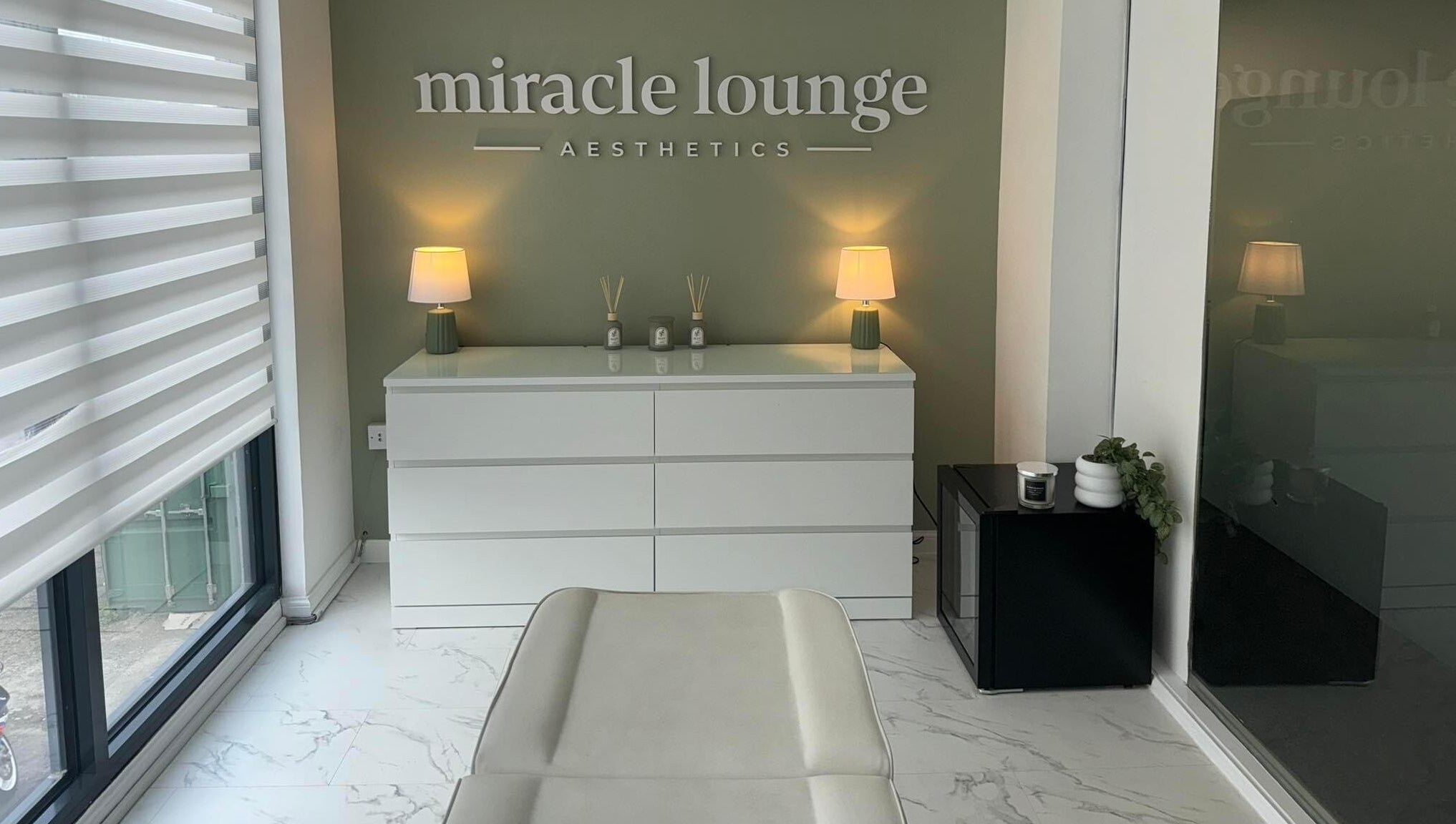 Elegant Miracle Lounge interior in Glasgow, Scotland, GB featuring sleek decor and ambient lighting.