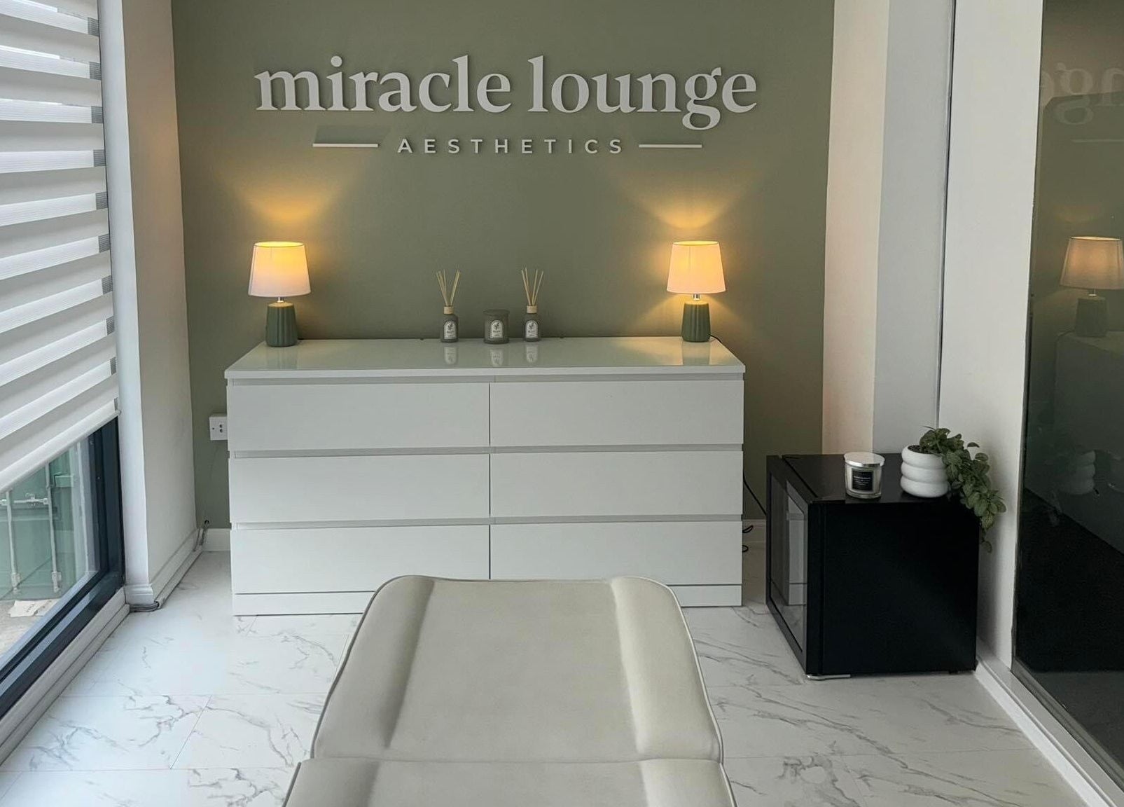 Elegant Miracle Lounge interior in Glasgow, Scotland, GB featuring sleek decor and ambient lighting.