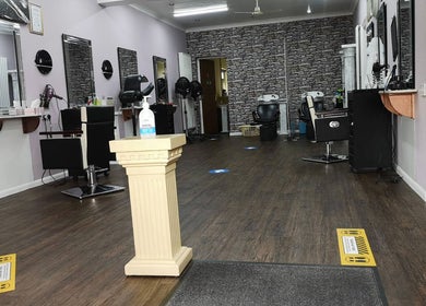 Interior view of Medusa's Hair and Beauty Salon in Lowestoft, England, GB, featuring modern styling stations.