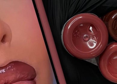 Close-up of glossy lips and makeup containers at Shaped Co., Westhoughton, England, GB.