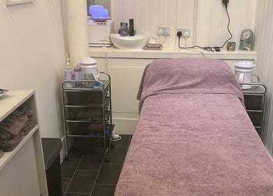 Cozy treatment room at Beauty by Lynsey in Elgin, Scotland, GB with massage table and calming decor.