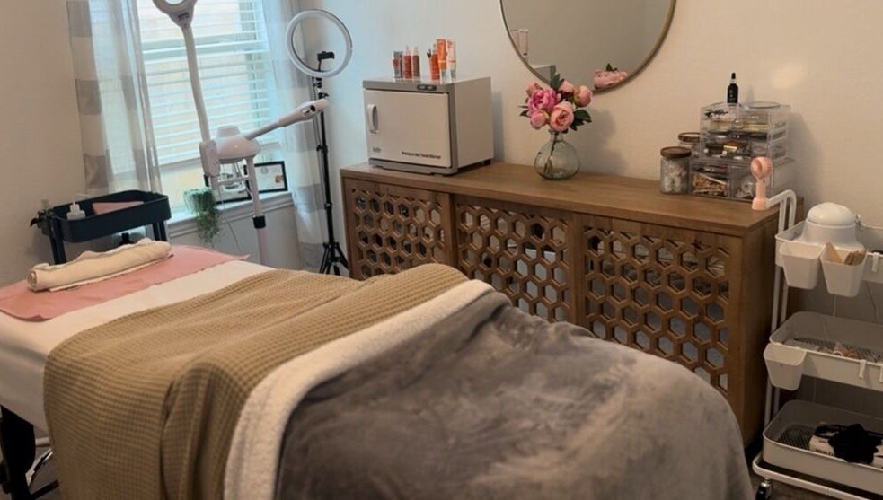 Relaxing treatment room at Fuller Esthetics, Montgomery, Texas, US, with cozy decor and professional equipment.