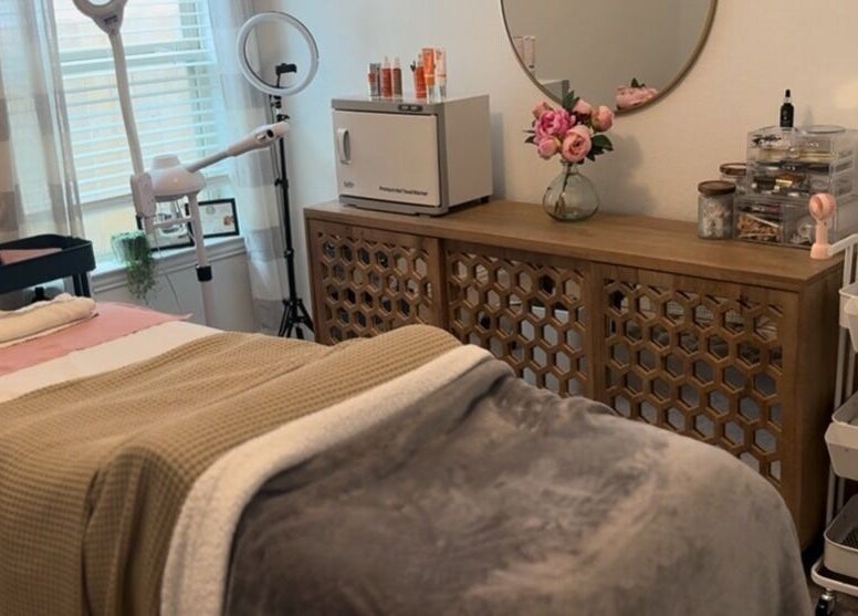 Relaxing treatment room at Fuller Esthetics, Montgomery, Texas, US, with cozy decor and professional equipment.