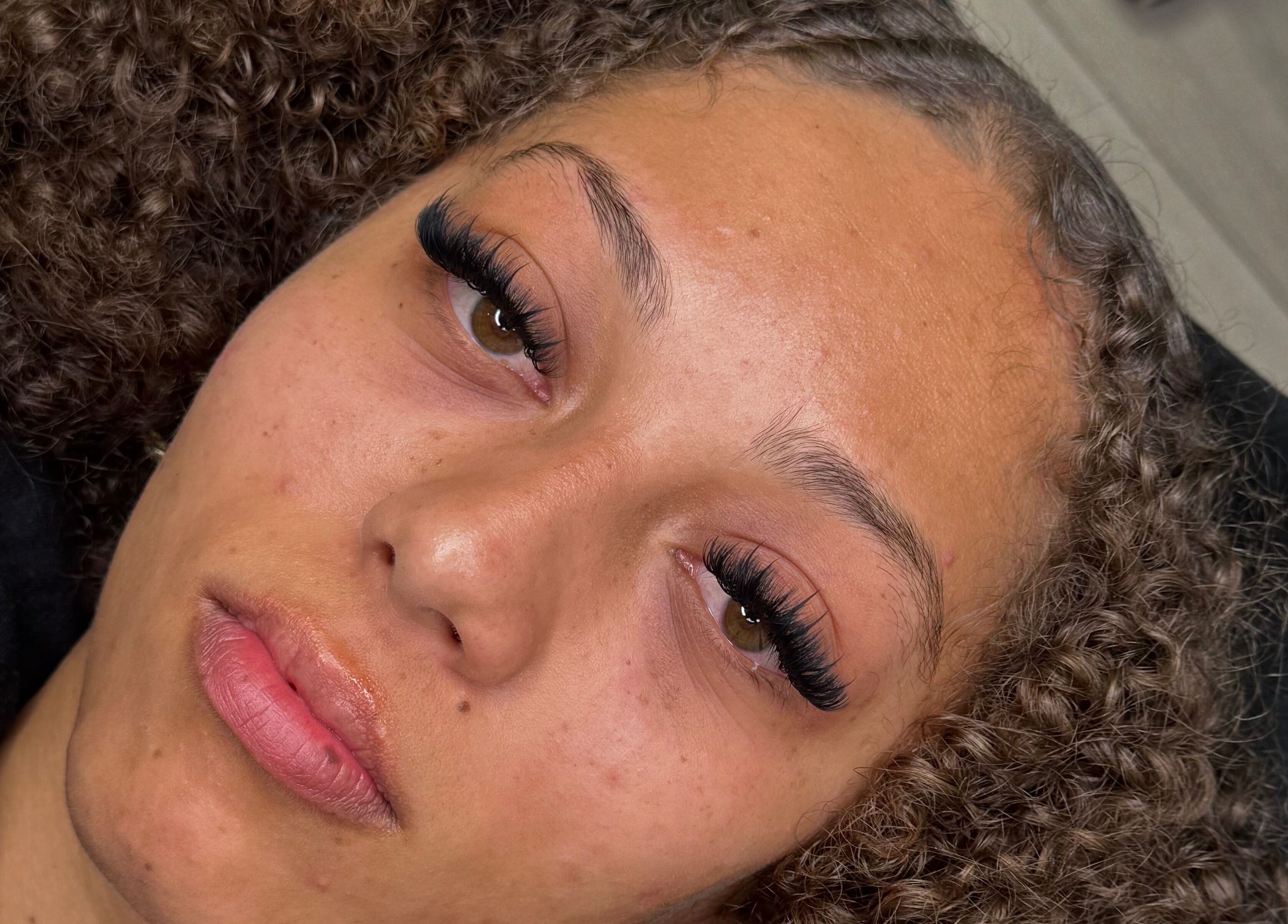 Close-up of a woman's face showcasing elegant lash extensions at By Chaks, Wellingborough, England, GB.