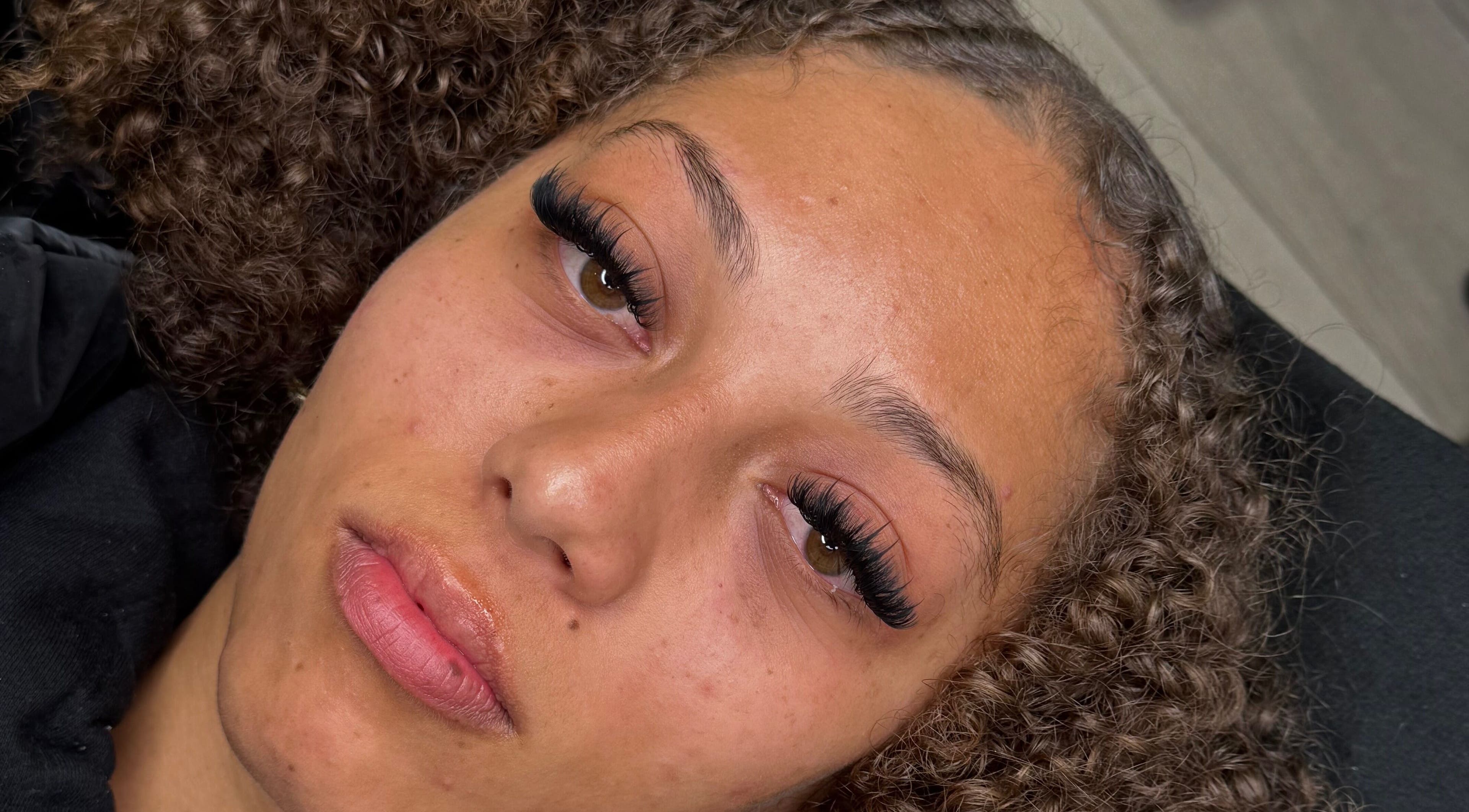 Close-up of a woman's face showcasing elegant lash extensions at By Chaks, Wellingborough, England, GB.