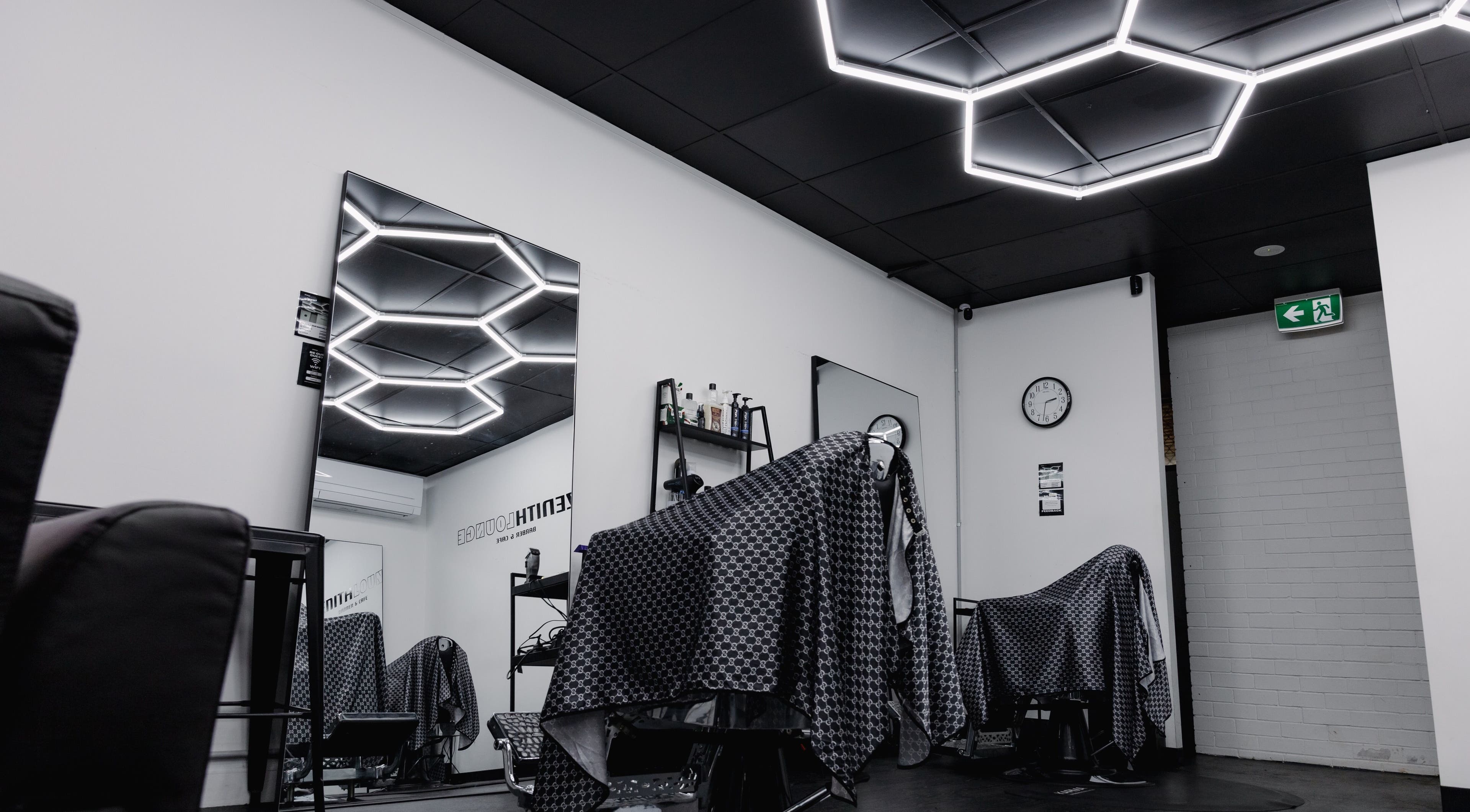 Modern barber setting at Zenith Lounge Barber & Cafe Tarragindi, Tarragindi, QLD, AU with sleek lighting.