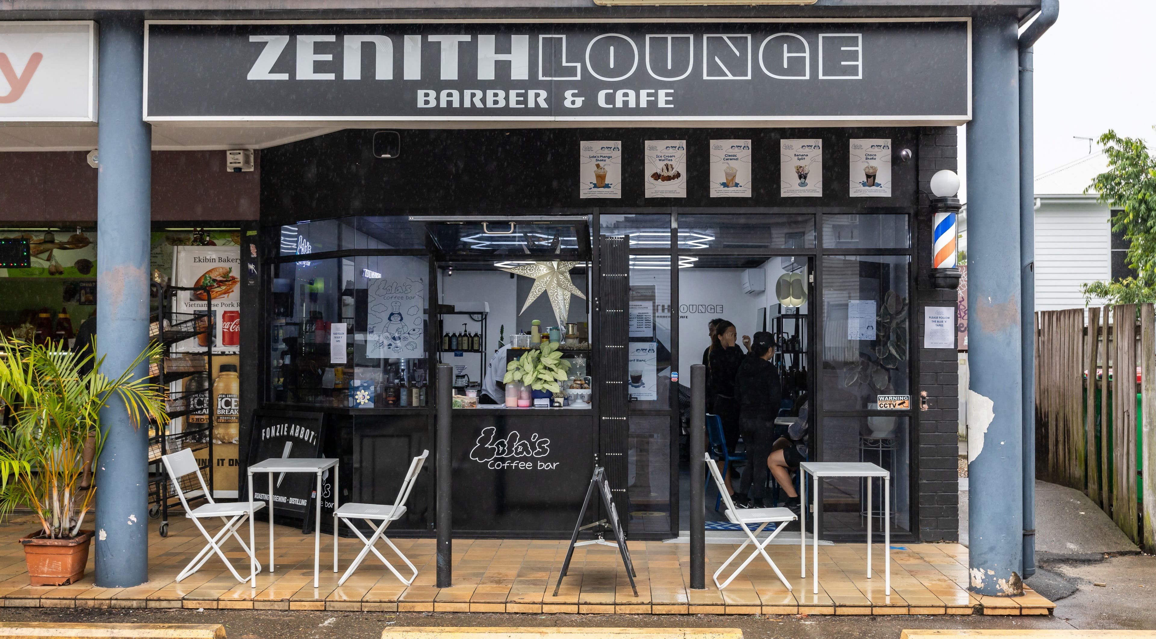 Front of Zenith Lounge Barber & Cafe Tarragindi, showcasing stylish outdoor seating in Tarragindi, QLD, AU.