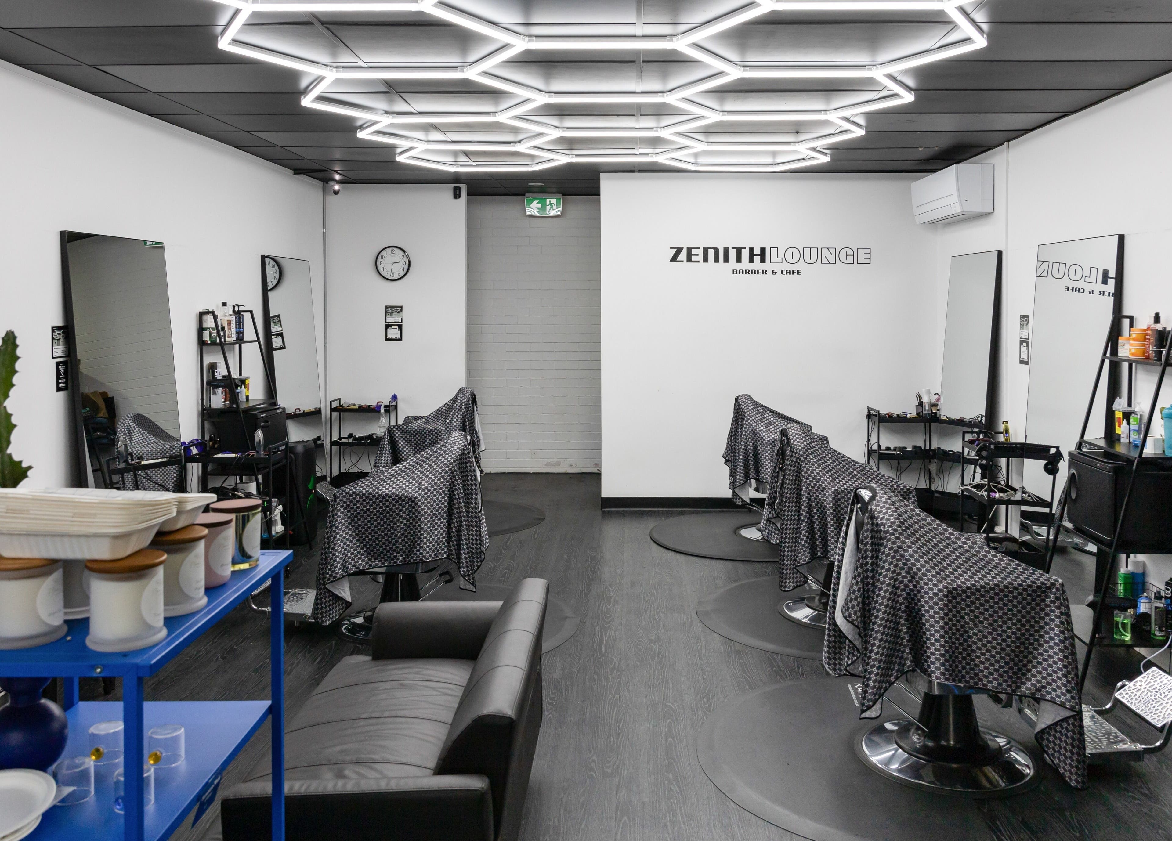 Chic interior of Zenith Lounge Barber & Cafe Tarragindi, in Tarragindi, QLD, AU, featuring modern decor and seating.