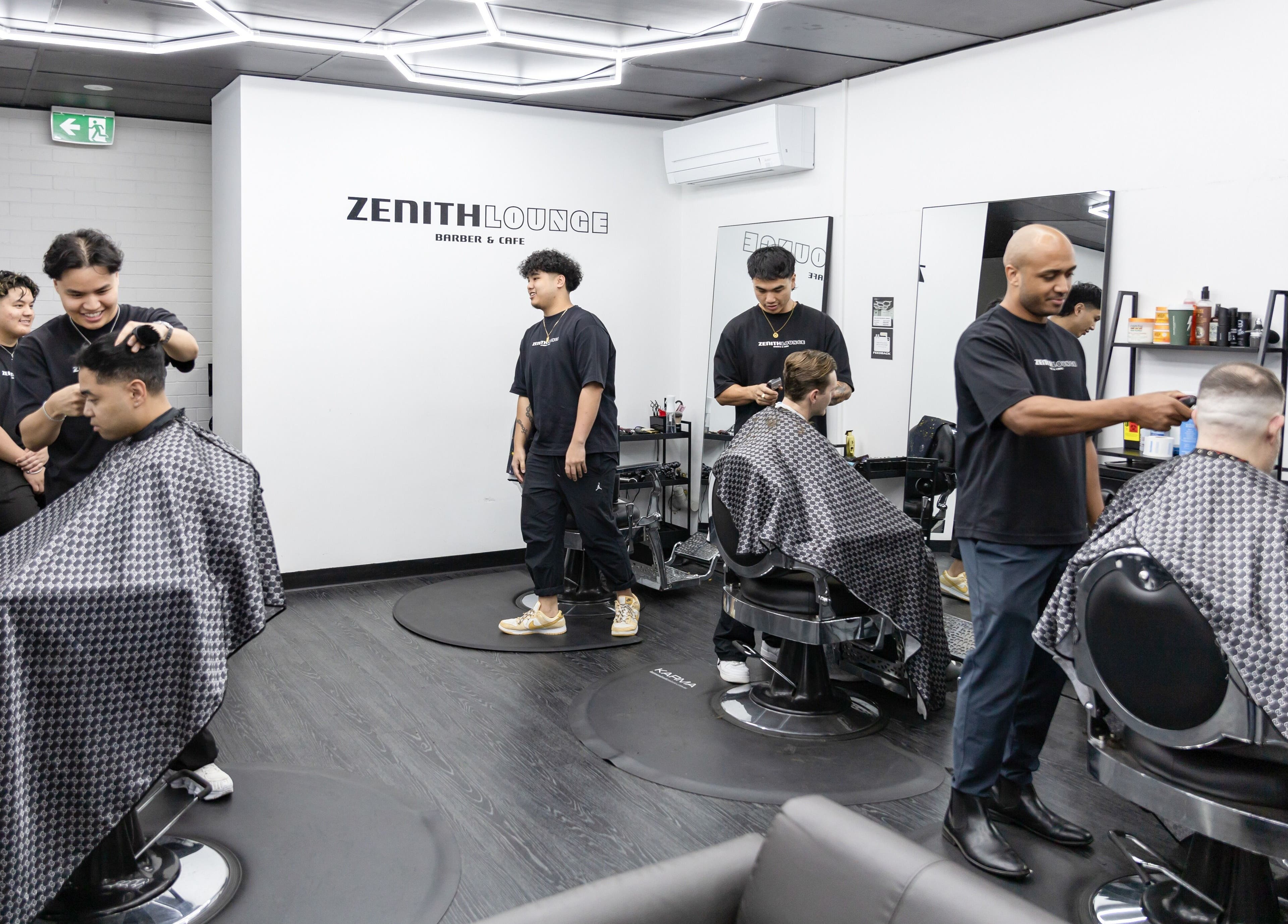Stylish barbers in action at Zenith Lounge Barber & Cafe Tarragindi, QLD, AU, offering grooming services.