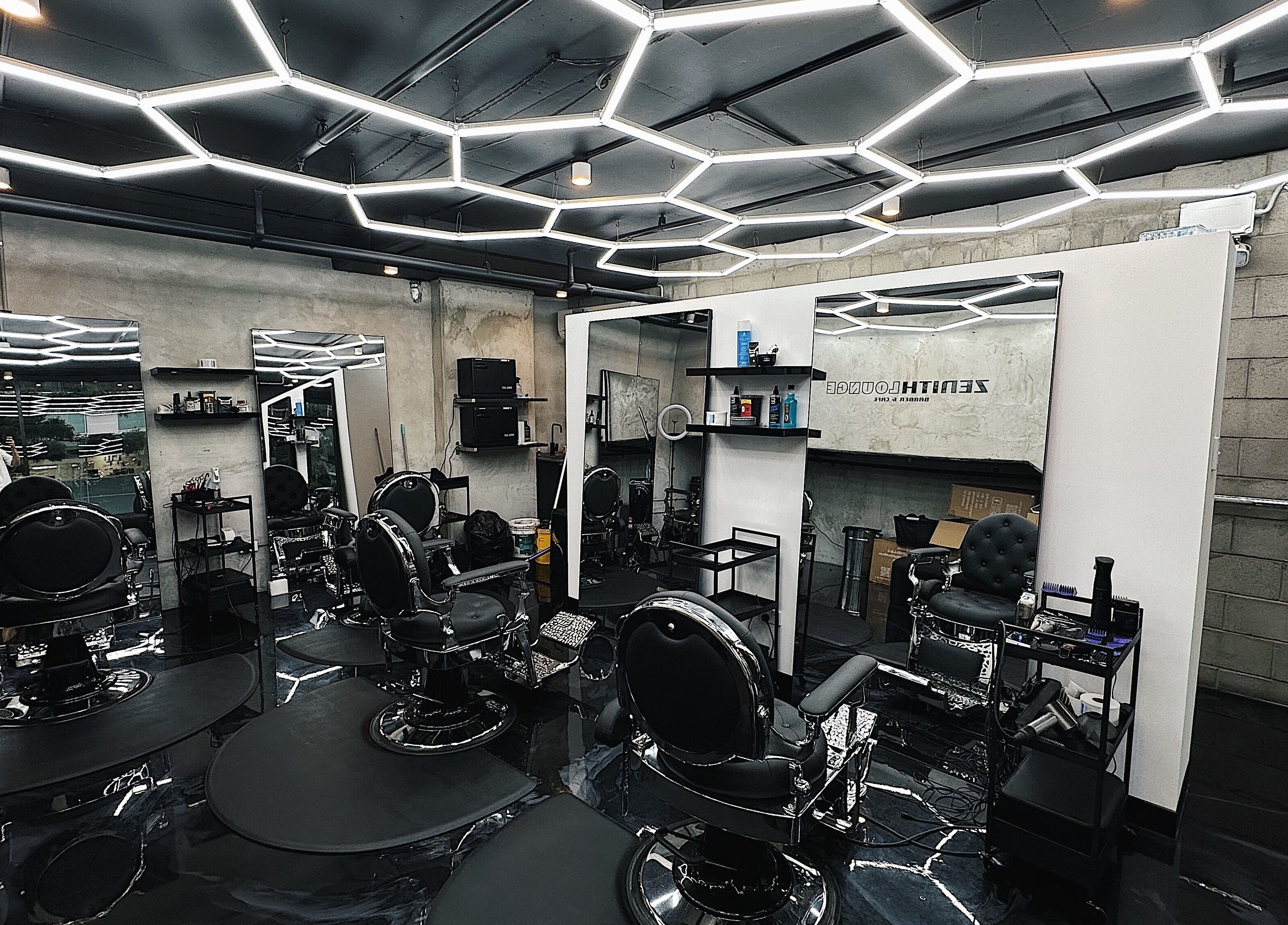 Stylish interior of Zenith Lounge Barber & Cafe Kelvin Grove, Kelvin Grove, Queensland, AU with modern barber chairs.